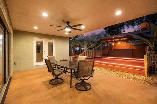 a view of a dining room with furniture and a chandelier