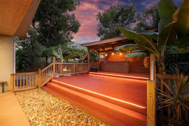 a view of a backyard with wooden floor