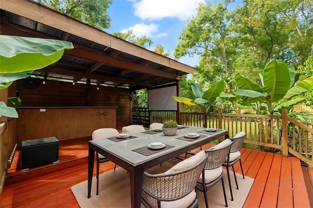 a view of a chairs and table in the patio