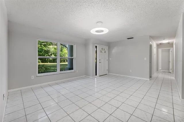 a view of an empty room and window