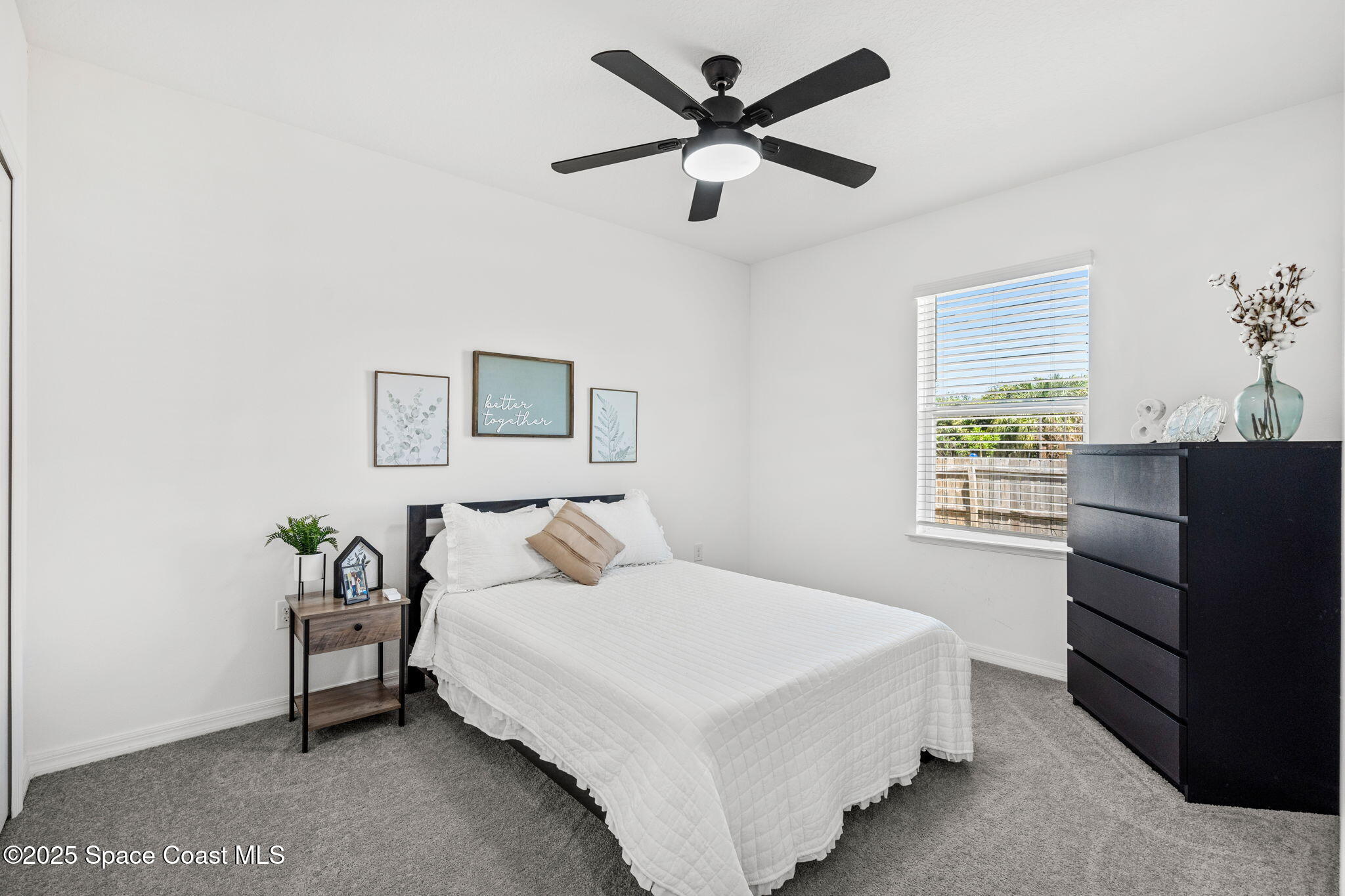 6162 Rena Avenue Cocoa, FL 32927 - Photo 19 of 42 a bedroom with a bed and a window