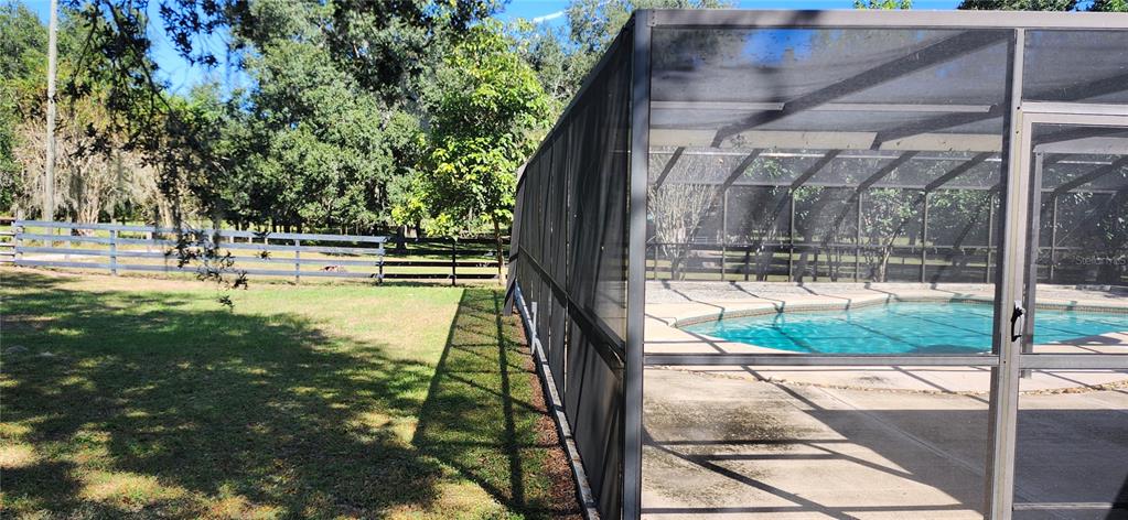 1804 East Wheeler Road Seffner, FL 33584 - Photo 11 of 25 a view of a swimming pool with a patio