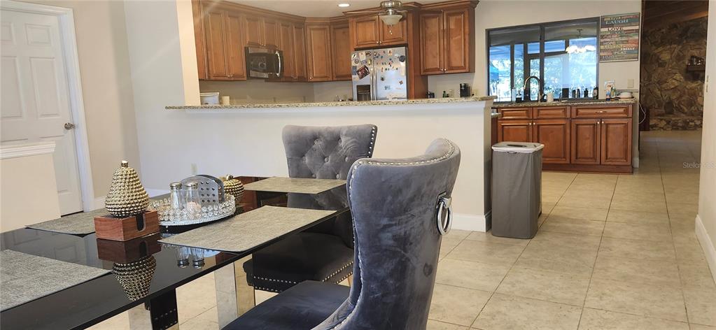 1804 East Wheeler Road Seffner, FL 33584 - Photo 16 of 25 a dining room with furniture and window