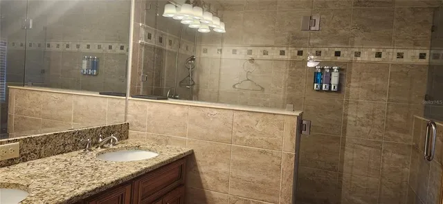 a bath tub sitting next to a shower