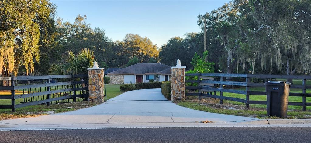 1804 East Wheeler Road Seffner, FL 33584 - Photo 5 of 25 a front view of a house with garden