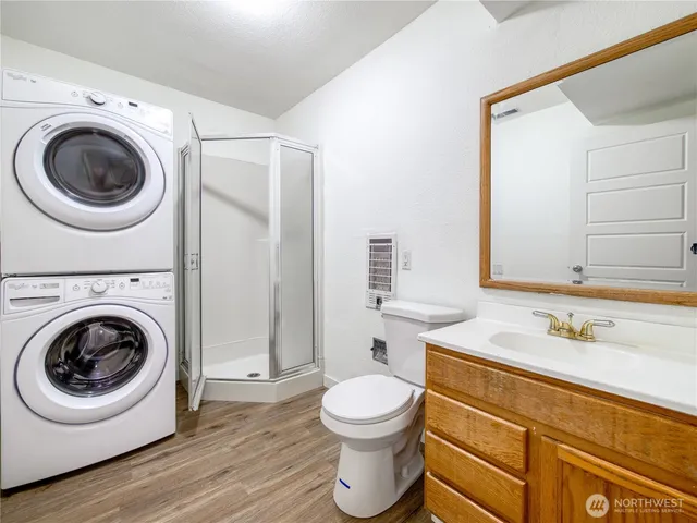 a bathroom with a toilet sink and a mirror