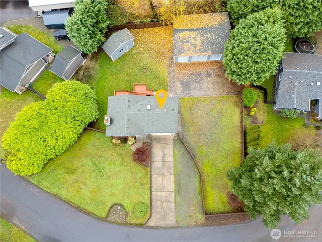 an aerial view of a residential houses with outdoor space