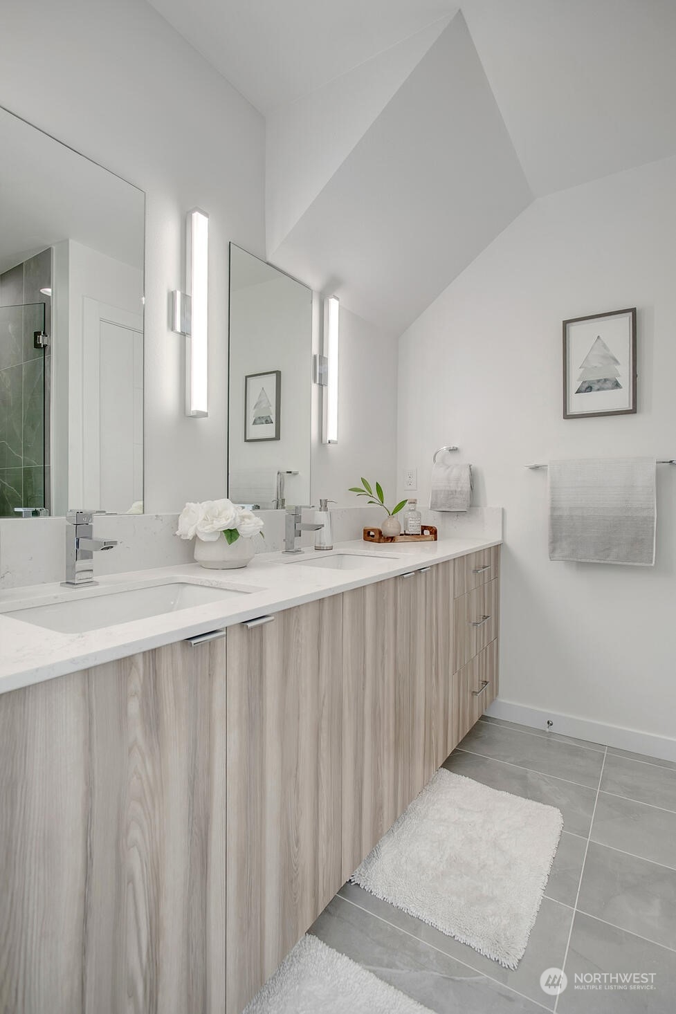 10170 Holman Road Northwest, Unit A Seattle, WA 98133 - Photo 7 of 13 a bathroom with a sink and a mirror
