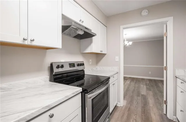 a kitchen with a stove and a microwave