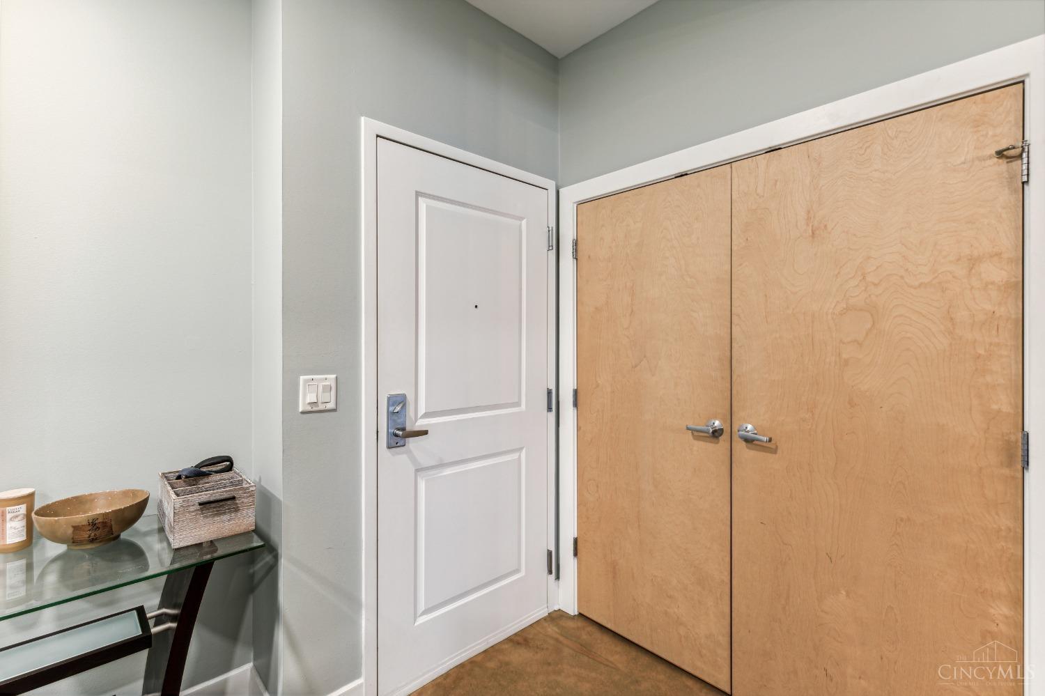 2260 Riverside Drive, Unit 205 Cincinnati, OH 45202 - Photo 7 of 37 Welcome to Unit 205. The entry of this modern loft features a large double door closet, stained concrete floors and is adjacent to the den/office/flex space...