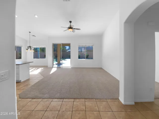 a view of a kitchen with a sink and refrigerator
