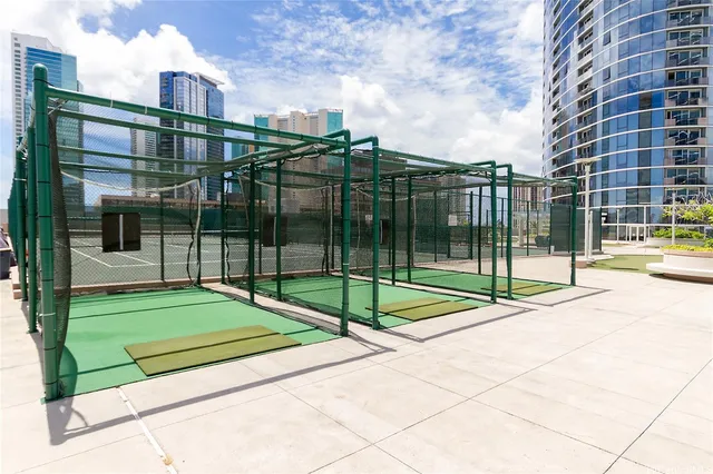 a view of a backyard with floor to ceiling windows