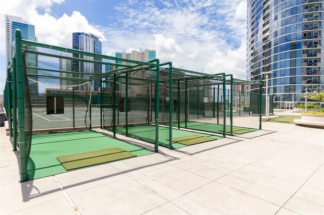 a view of a backyard with floor to ceiling windows