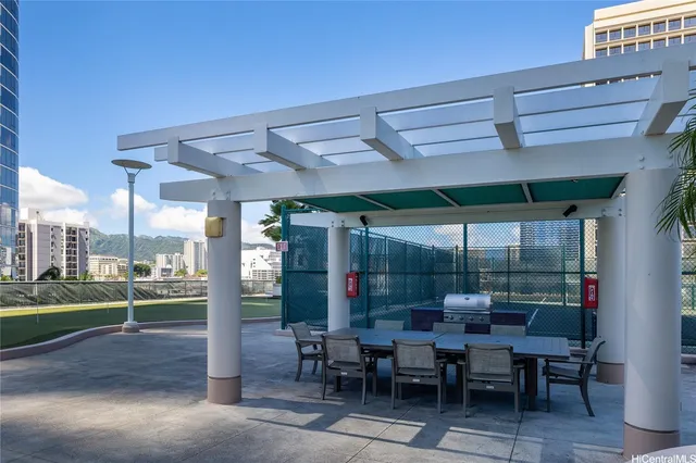 a view of a patio with a table and chairs