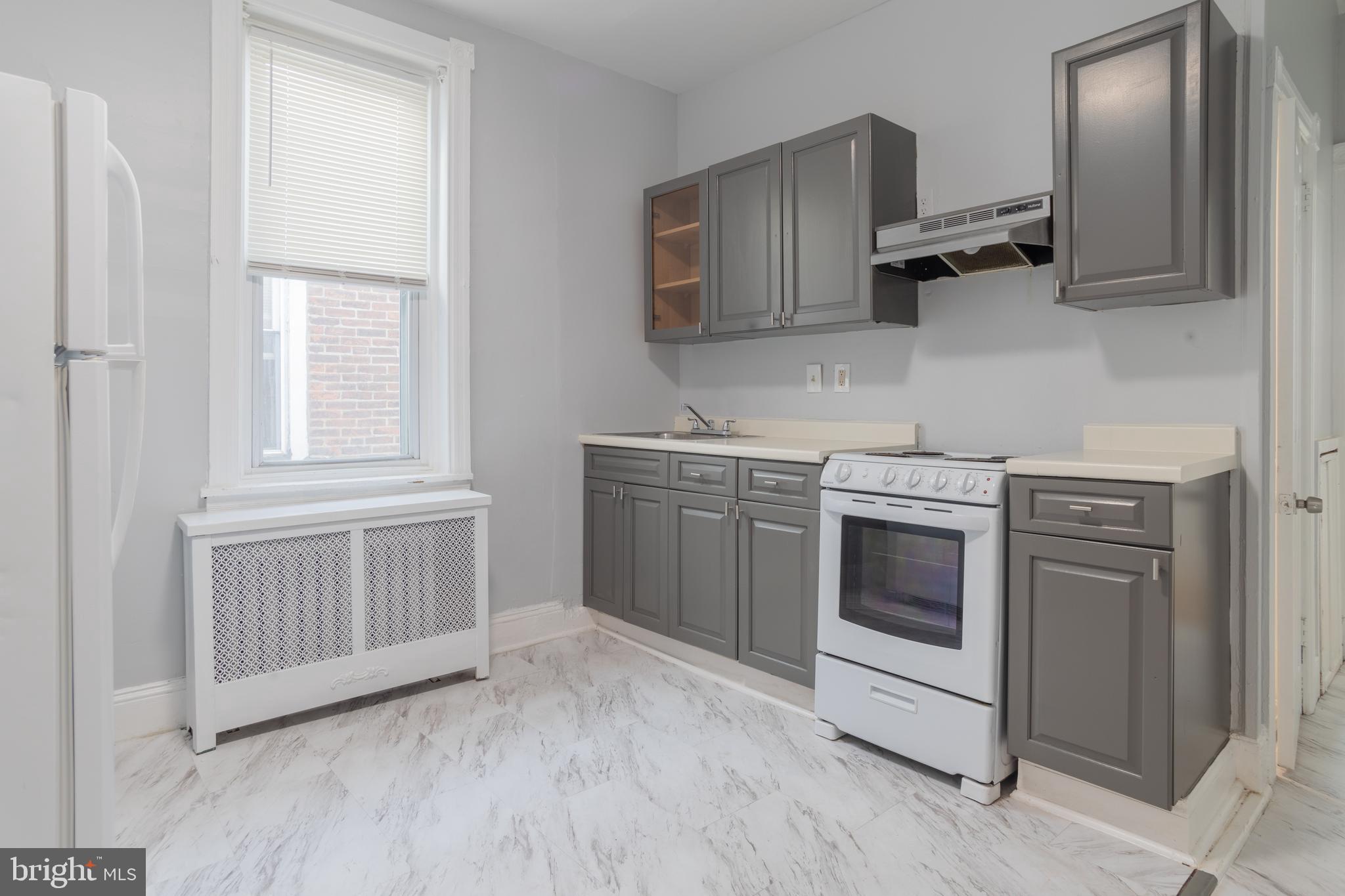 a kitchen with a stove and a microwave