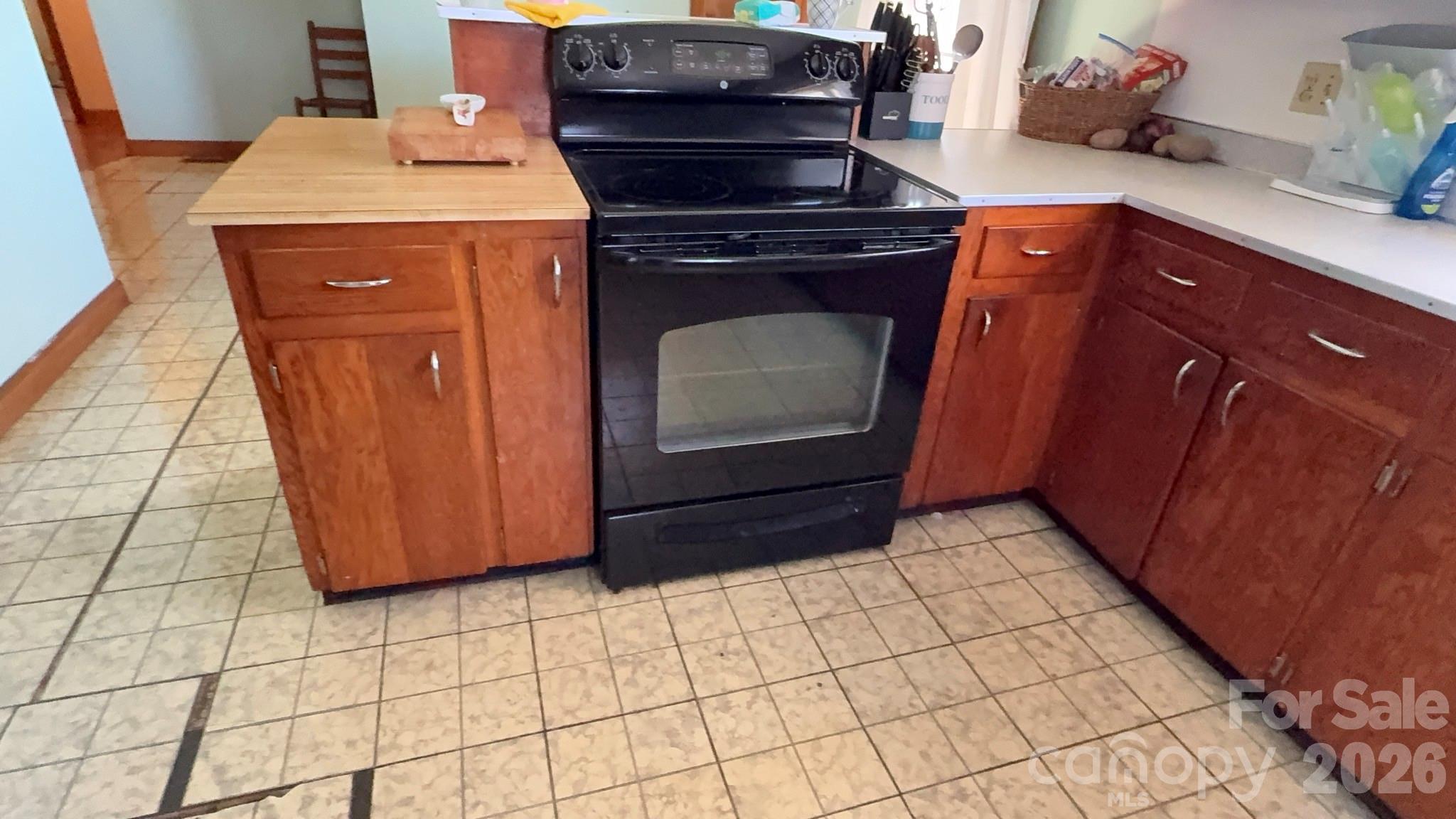 1582 Dutch Cove Road Canton, NC 28716 - Photo 15 of 47 a stove top oven sitting inside of a kitchen