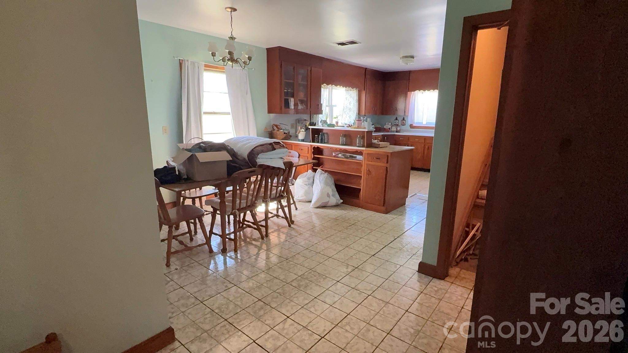 1582 Dutch Cove Road Canton, NC 28716 - Photo 17 of 47 a view of a dining room with furniture and window