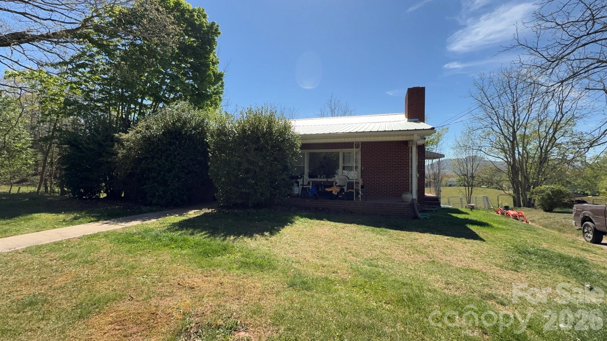 1582 Dutch Cove Road Canton, NC 28716 - Photo 2 of 47 a view of a house with backyard porch and garden