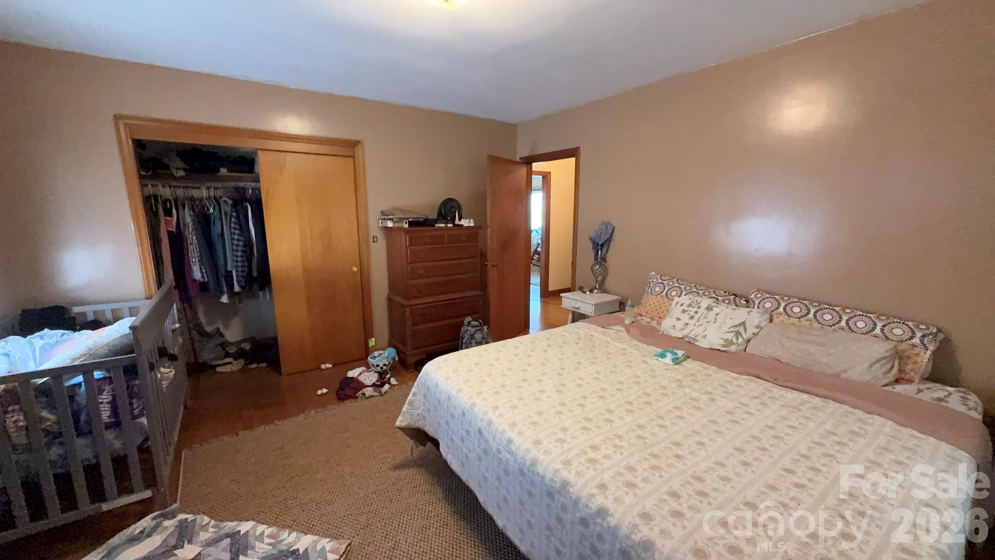 1582 Dutch Cove Road Canton, NC 28716 - Photo 26 of 47 a bedroom with a bed and a closet
