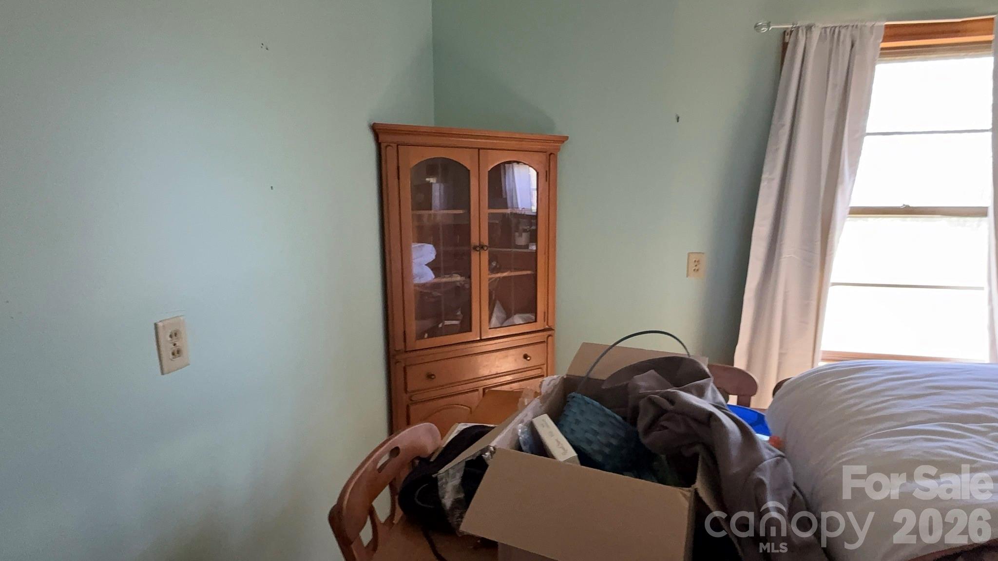 1582 Dutch Cove Road Canton, NC 28716 - Photo 28 of 47 a view of a bedroom with a bed and a window