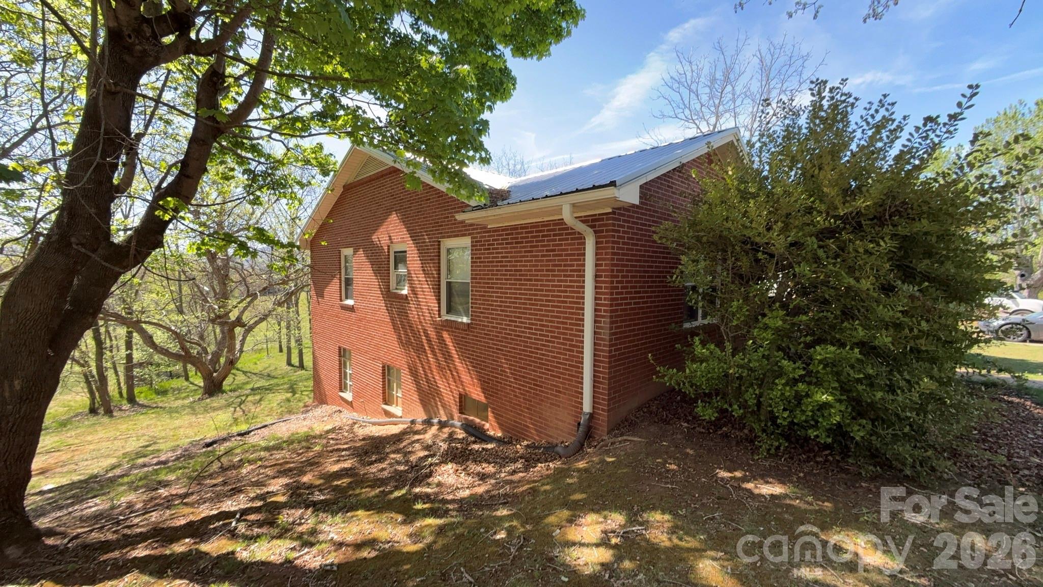 1582 Dutch Cove Road Canton, NC 28716 - Photo 3 of 47 a backyard of a house with a large tree and wooden fence
