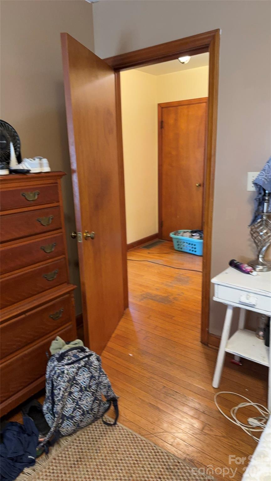 1582 Dutch Cove Road Canton, NC 28716 - Photo 35 of 47 a bedroom with a bed and a table in it