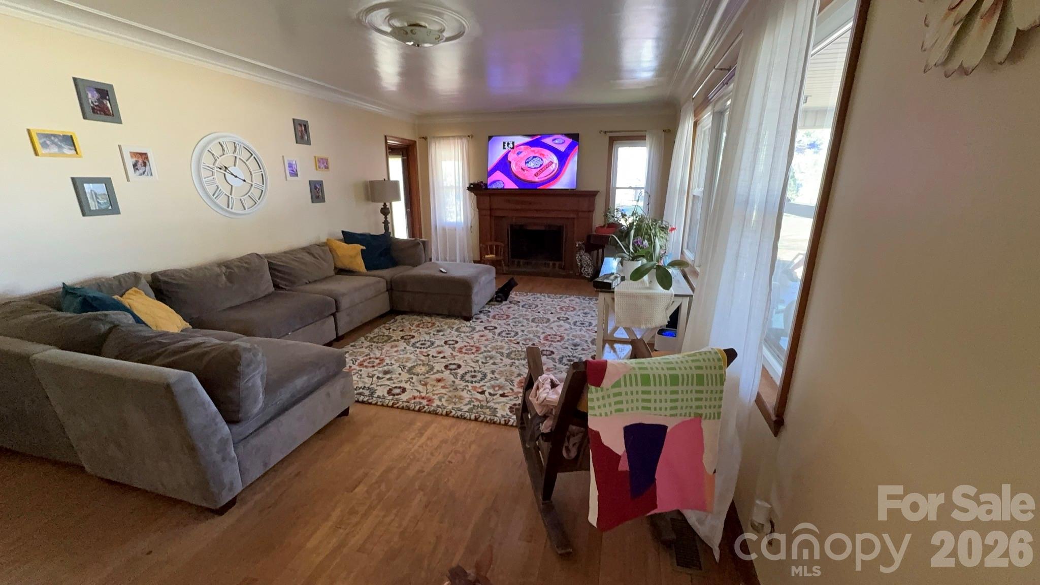 1582 Dutch Cove Road Canton, NC 28716 - Photo 10 of 47 a living room with furniture and a fireplace