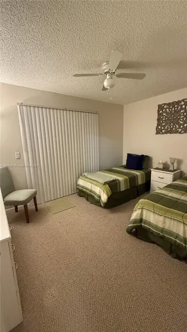 a bedroom with bed and a couch