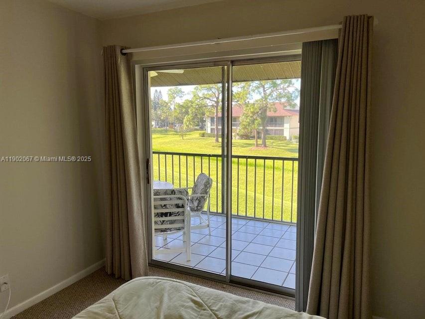 6327 Chasewood Drive, Unit G Jupiter, FL 33458 - Photo 27 of 35 a view of a room with window