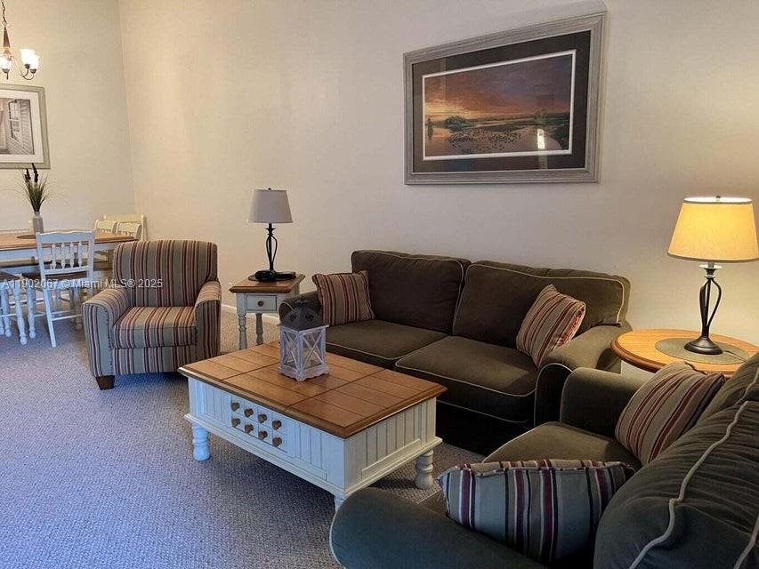 6327 Chasewood Drive, Unit G Jupiter, FL 33458 - Photo 3 of 35 a living room with furniture