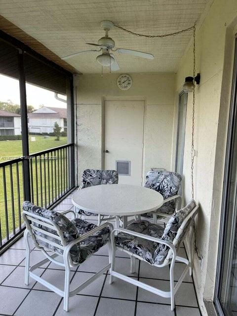 6327 Chasewood Drive, Unit G Jupiter, FL 33458 - Photo 33 of 35 a table that has a table and chairs in it