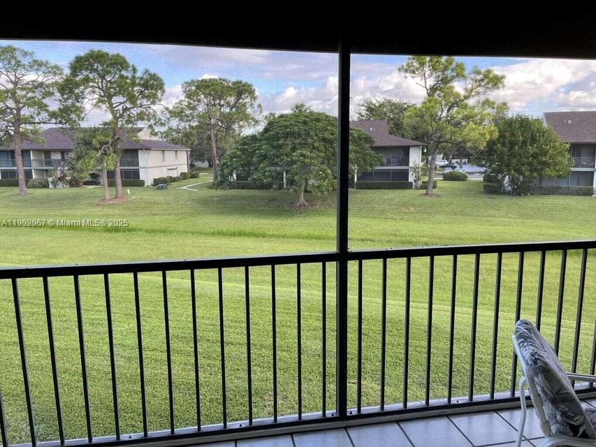6327 Chasewood Drive, Unit G Jupiter, FL 33458 - Photo 35 of 35 a view of outdoor space with deck and yard