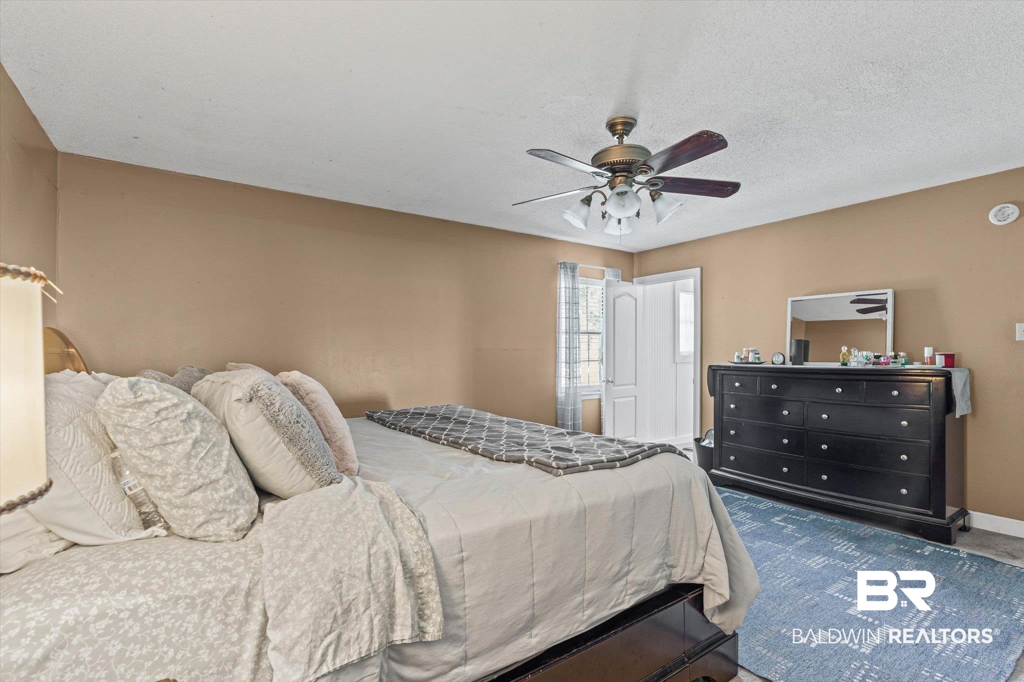 11440 Diffee Road Grand Bay, AL 36541 - Photo 13 of 22 Bedroom with ceiling fan and a textured ceiling
