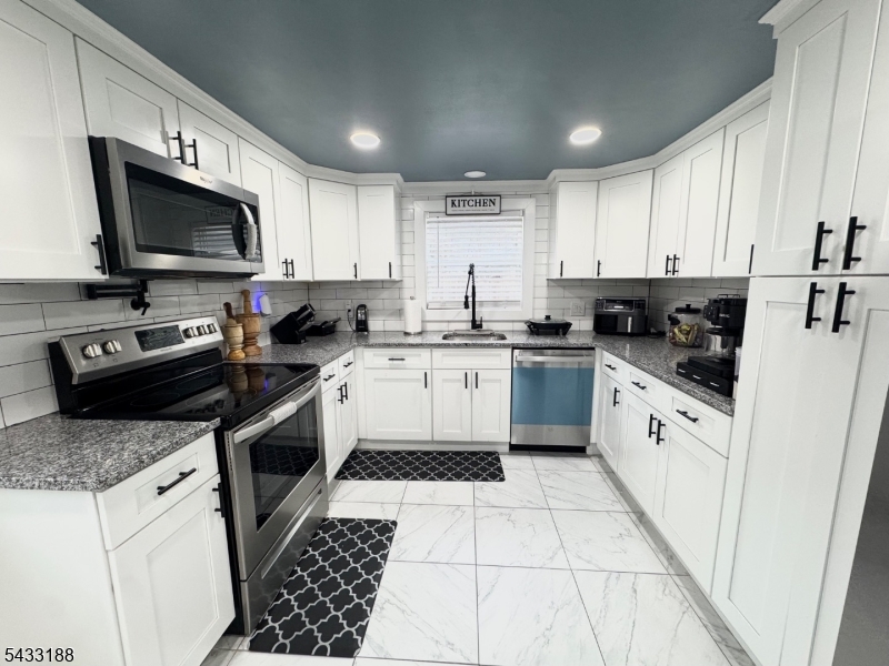 13 Highway 46 Columbia, NJ 07832 - Photo 7 of 22 a kitchen with a sink stove top oven and cabinets