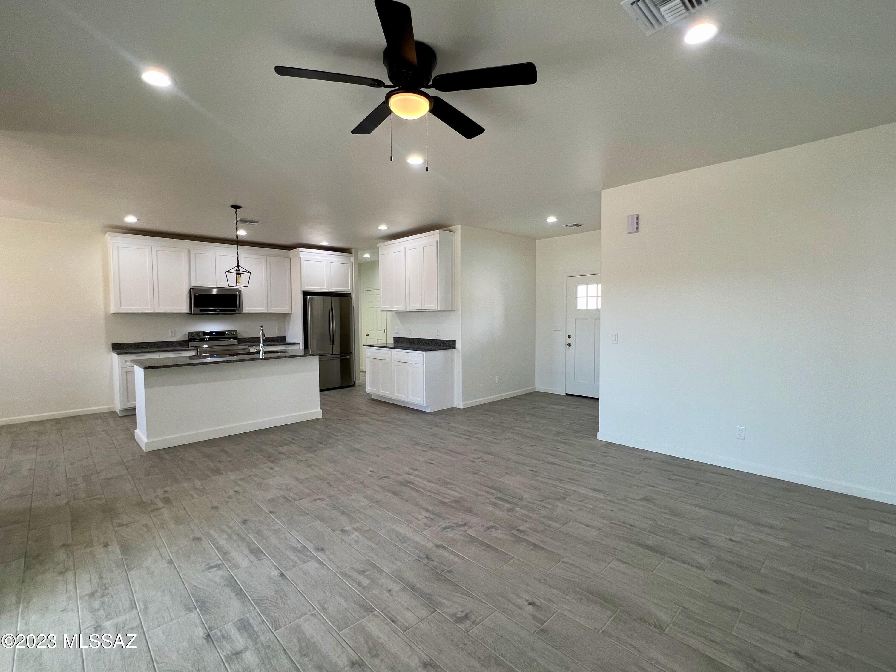 353 Dock Street Rio Rico, AZ 85648 - Photo 43 of 50 a view of kitchen with refrigerator microwave and stove