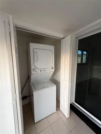 a view of an empty room with windows