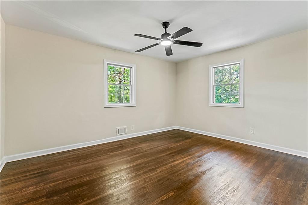 1576 South Gordon Road Southwest Austell, GA 30168 - Photo 15 of 33 a view of an empty room with wooden floor and a window