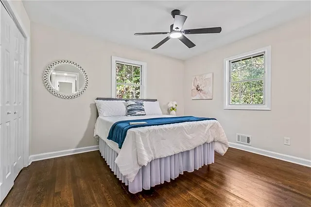 a bedroom with a bed and a window