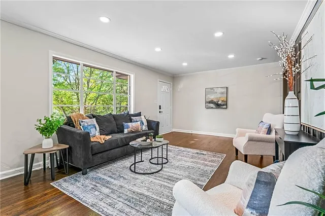 a living room with furniture and a large window