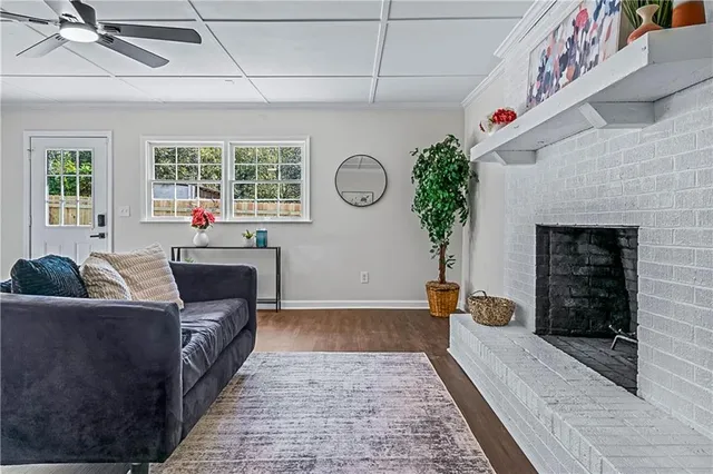 a living room with furniture and a fireplace