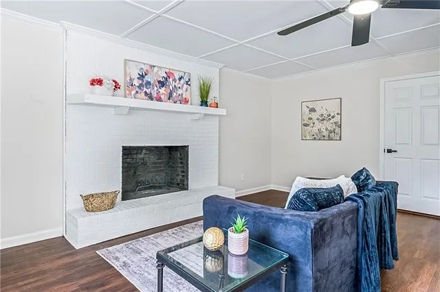 a living room with furniture and a fireplace