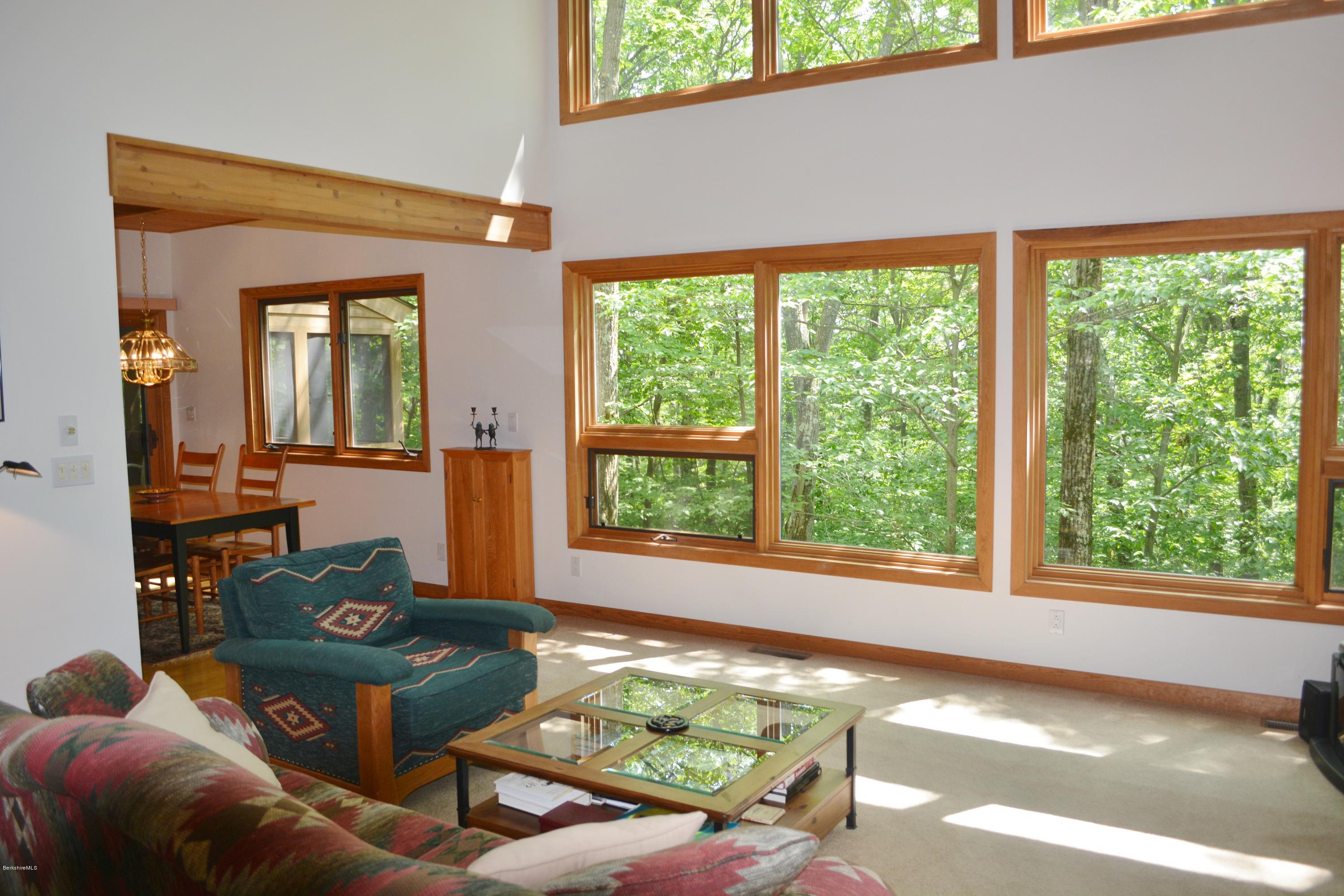 537 Norton Road Otis, MA 01029 - Photo 11 of 25 a living room with furniture and a large window