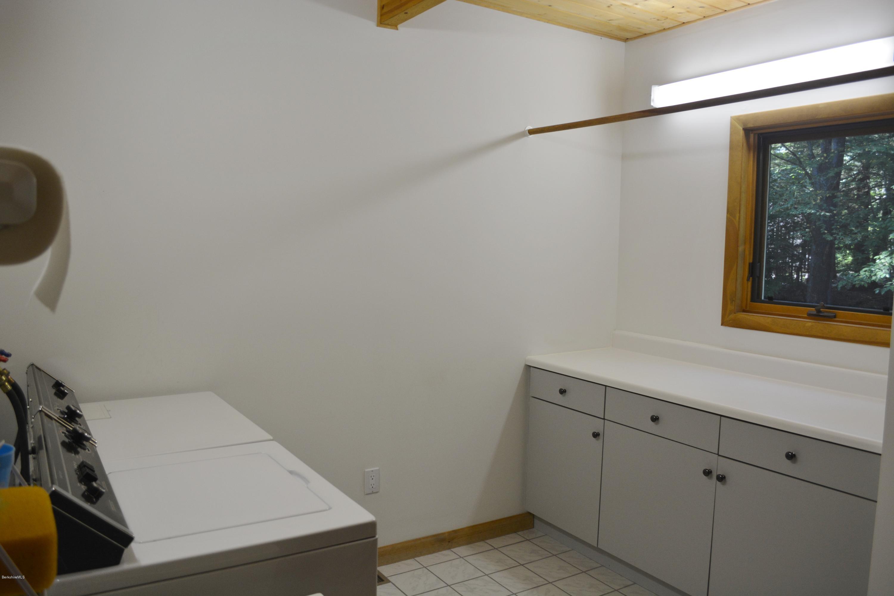537 Norton Road Otis, MA 01029 - Photo 14 of 25 a utility room with dryer and washer
