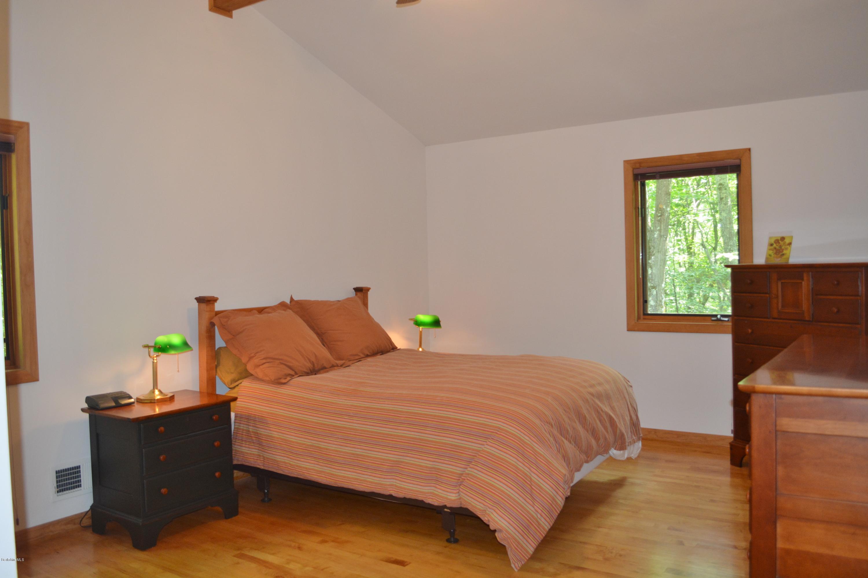 537 Norton Road Otis, MA 01029 - Photo 16 of 25 a bedroom with a bed and a window