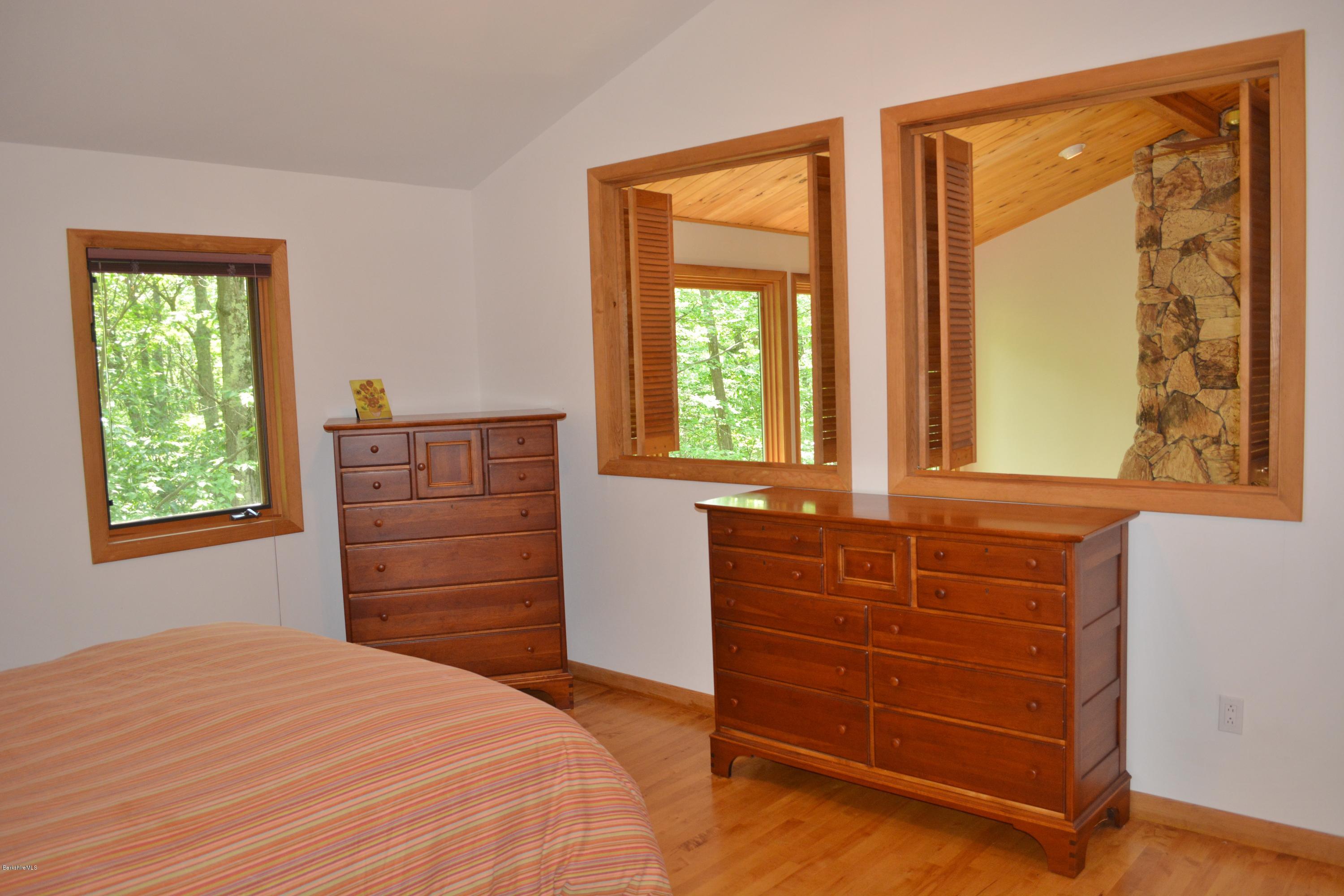 537 Norton Road Otis, MA 01029 - Photo 17 of 25 a room with a dresser next to a window