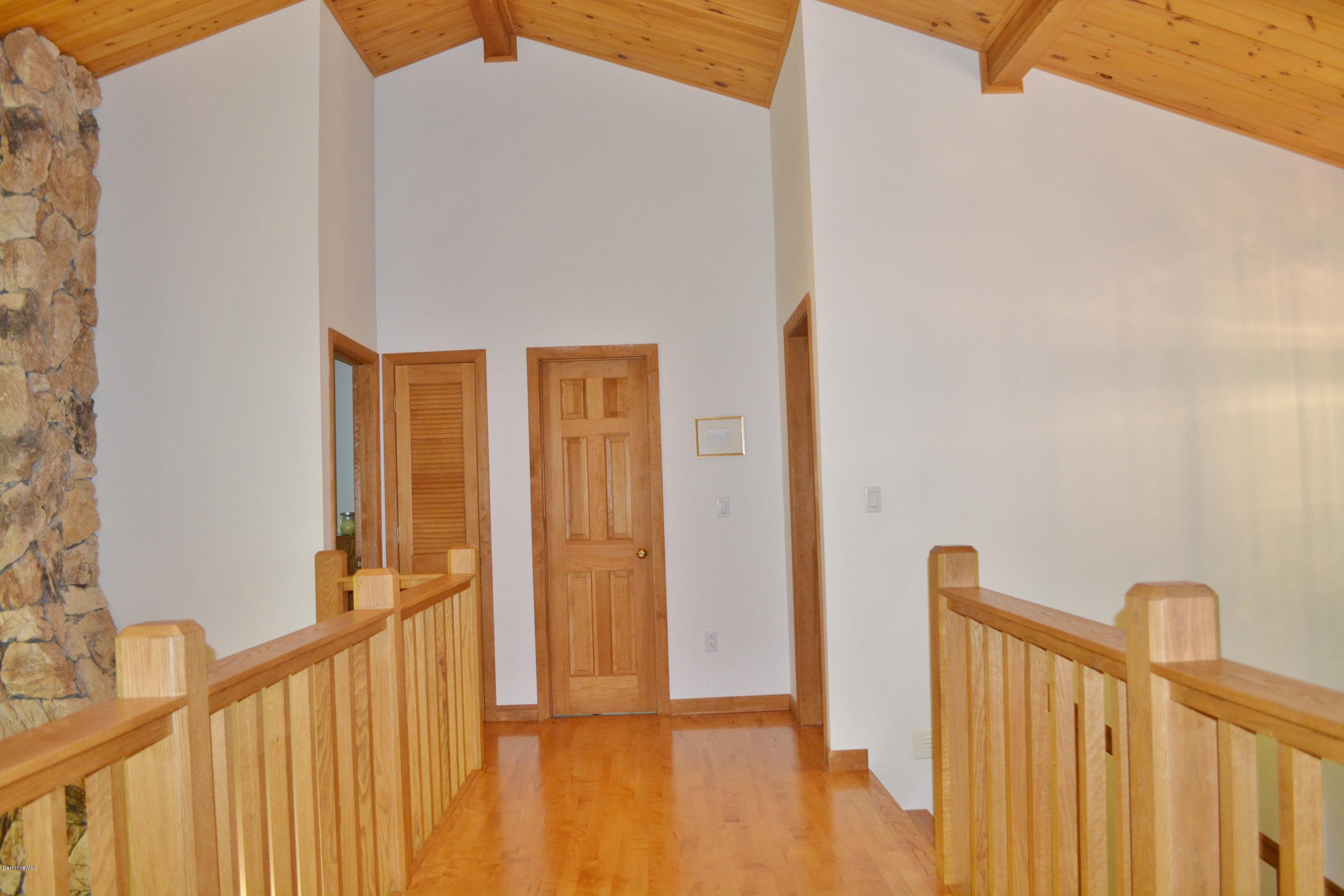 537 Norton Road Otis, MA 01029 - Photo 20 of 25 a view of a hallway with wooden floor and entryway