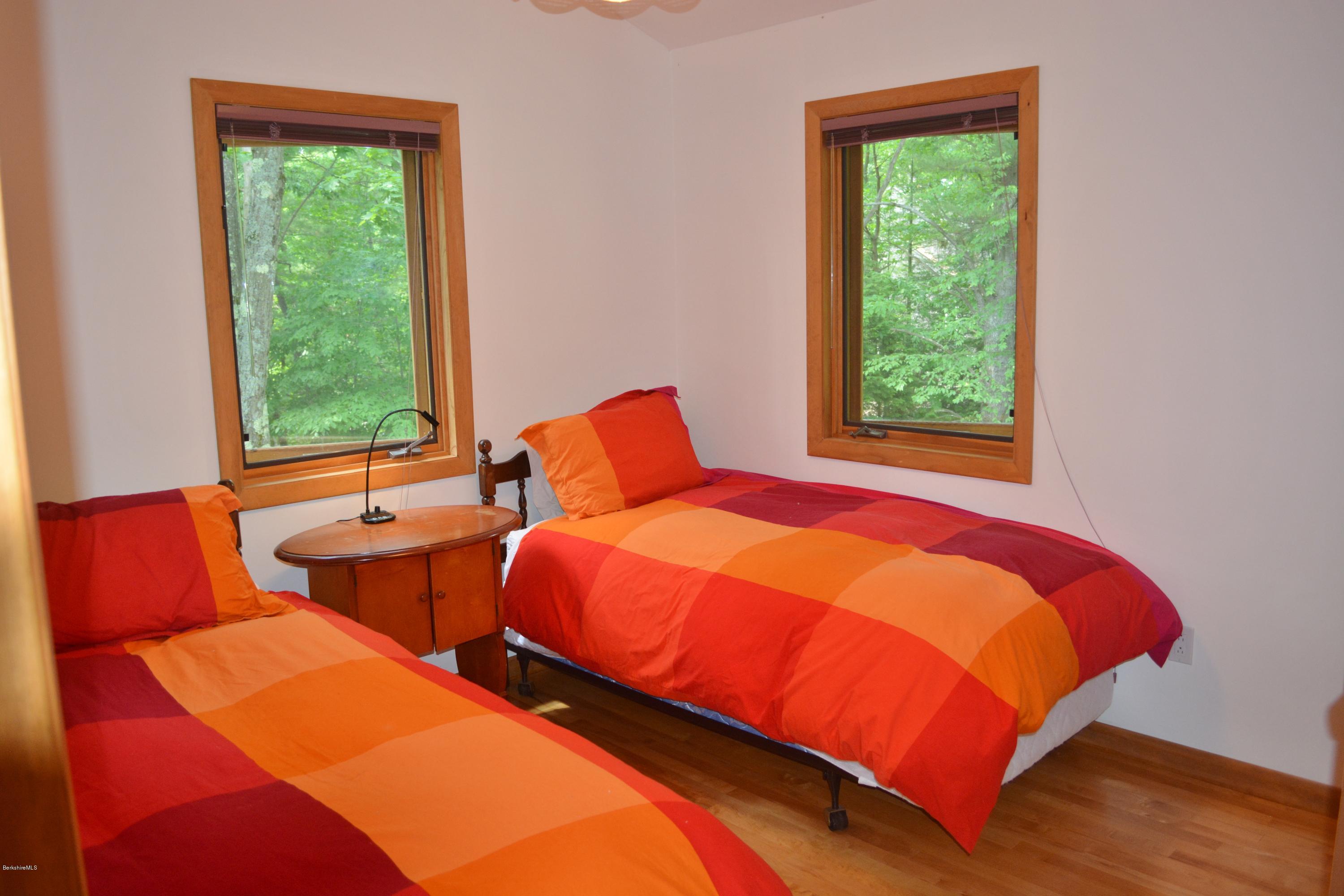 537 Norton Road Otis, MA 01029 - Photo 22 of 25 a bedroom with two beds and a window