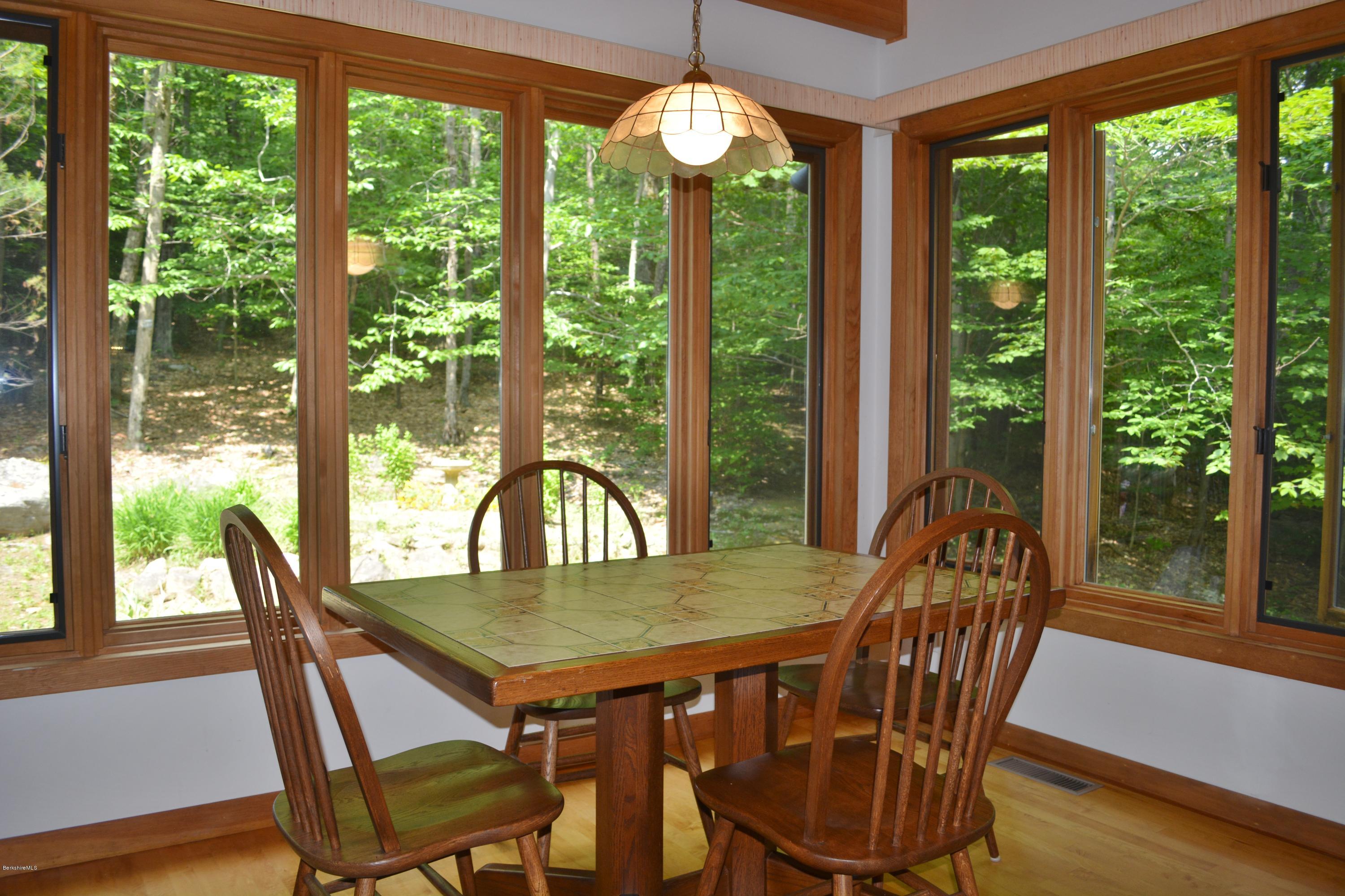 537 Norton Road Otis, MA 01029 - Photo 4 of 25 a view of a dining room with furniture window and outside view