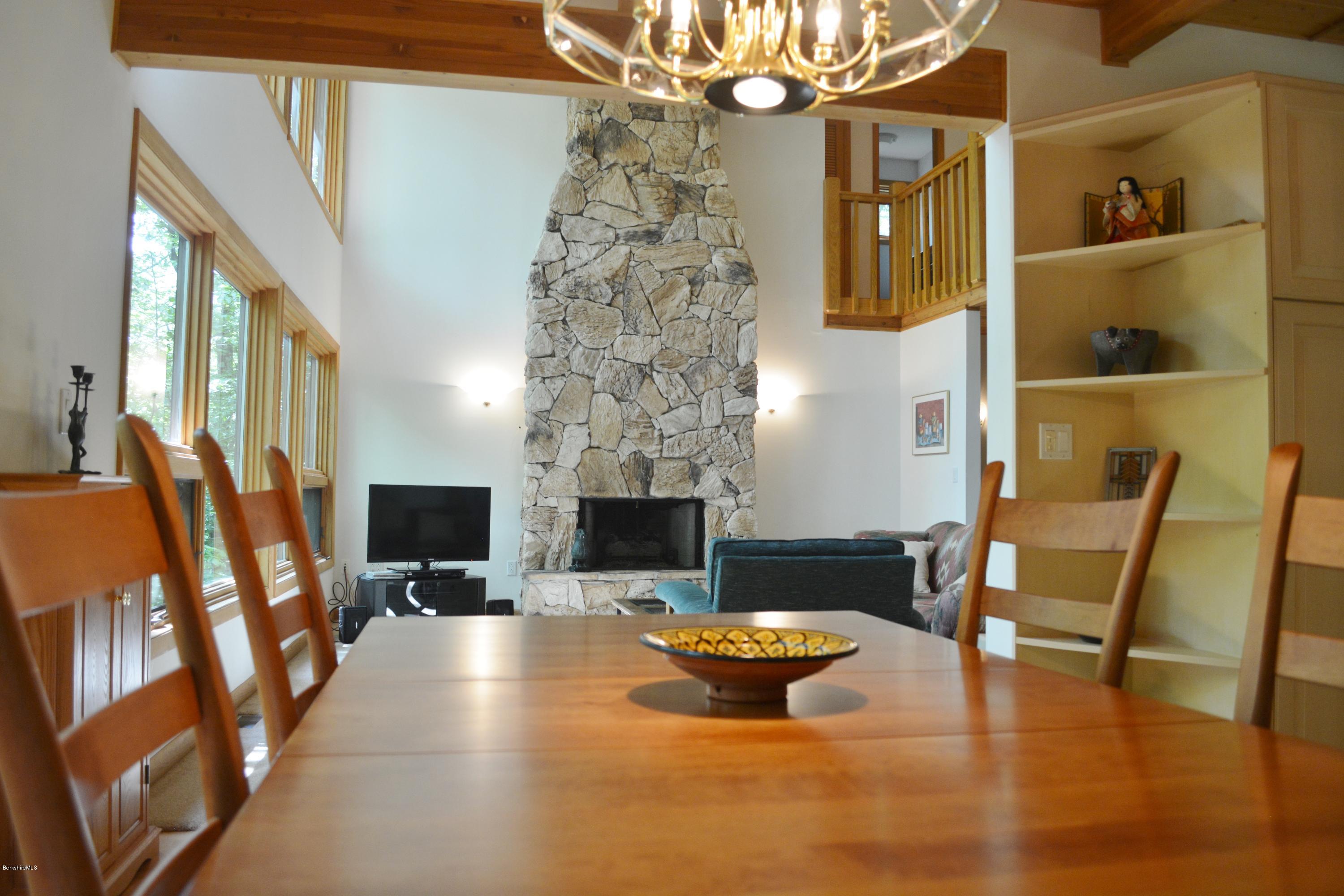 537 Norton Road Otis, MA 01029 - Photo 9 of 25 a living room with furniture and a fireplace