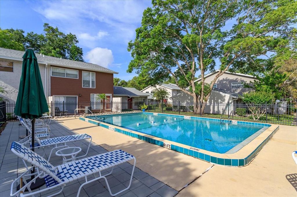2786 Curry Ford Road, Unit 6B Orlando, FL 32806 - Photo 20 of 27 an outdoor space with swimming pool and furniture